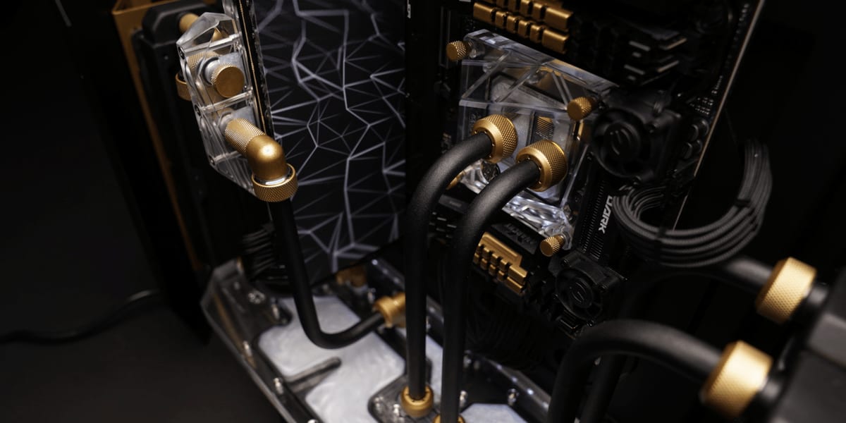 An assembled loop with clear acrylic blocks and brass fittings